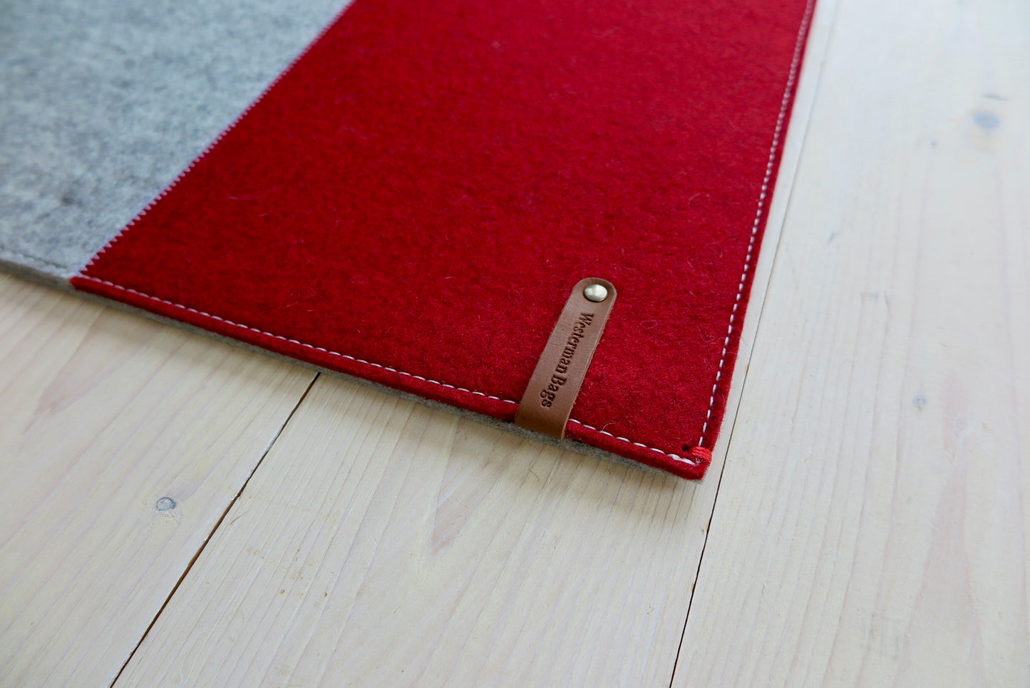 100% wool felt laptop cover in gray and orange, leather closure and extra box