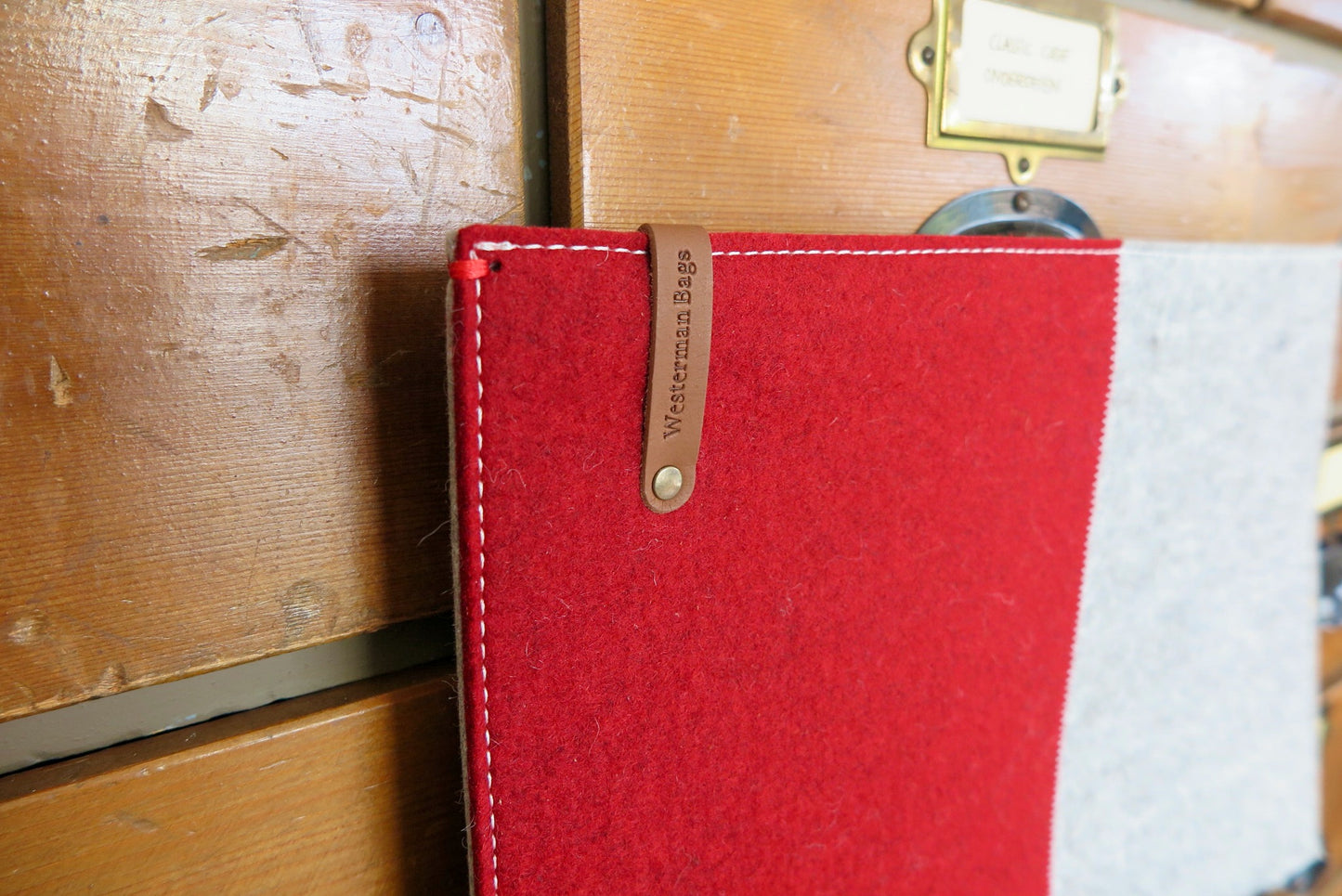 100% wool felt laptop cover in gray and orange, leather closure and extra box
