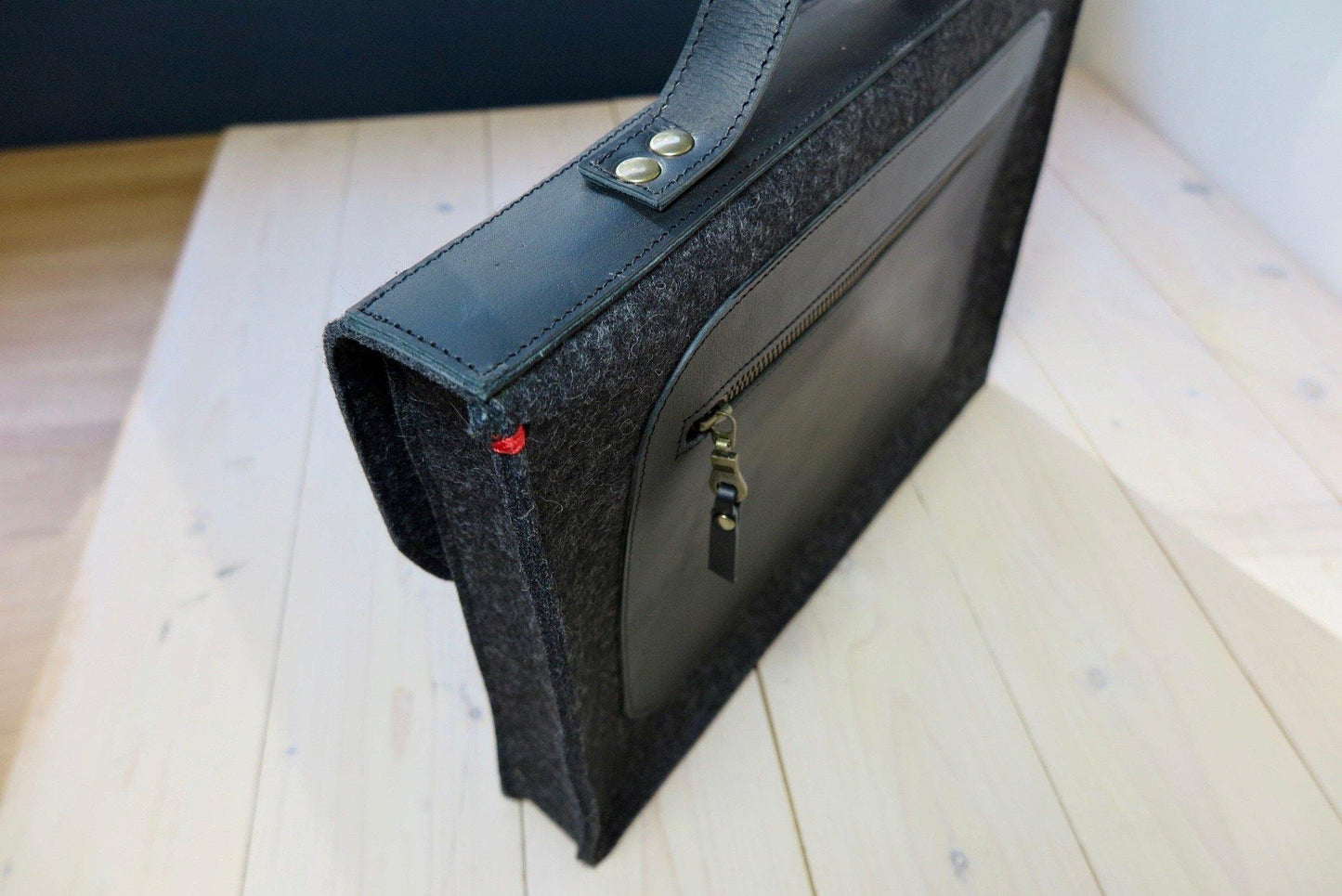 Black wool felt briefcase bag with leather details and zipper by Westerman Bags