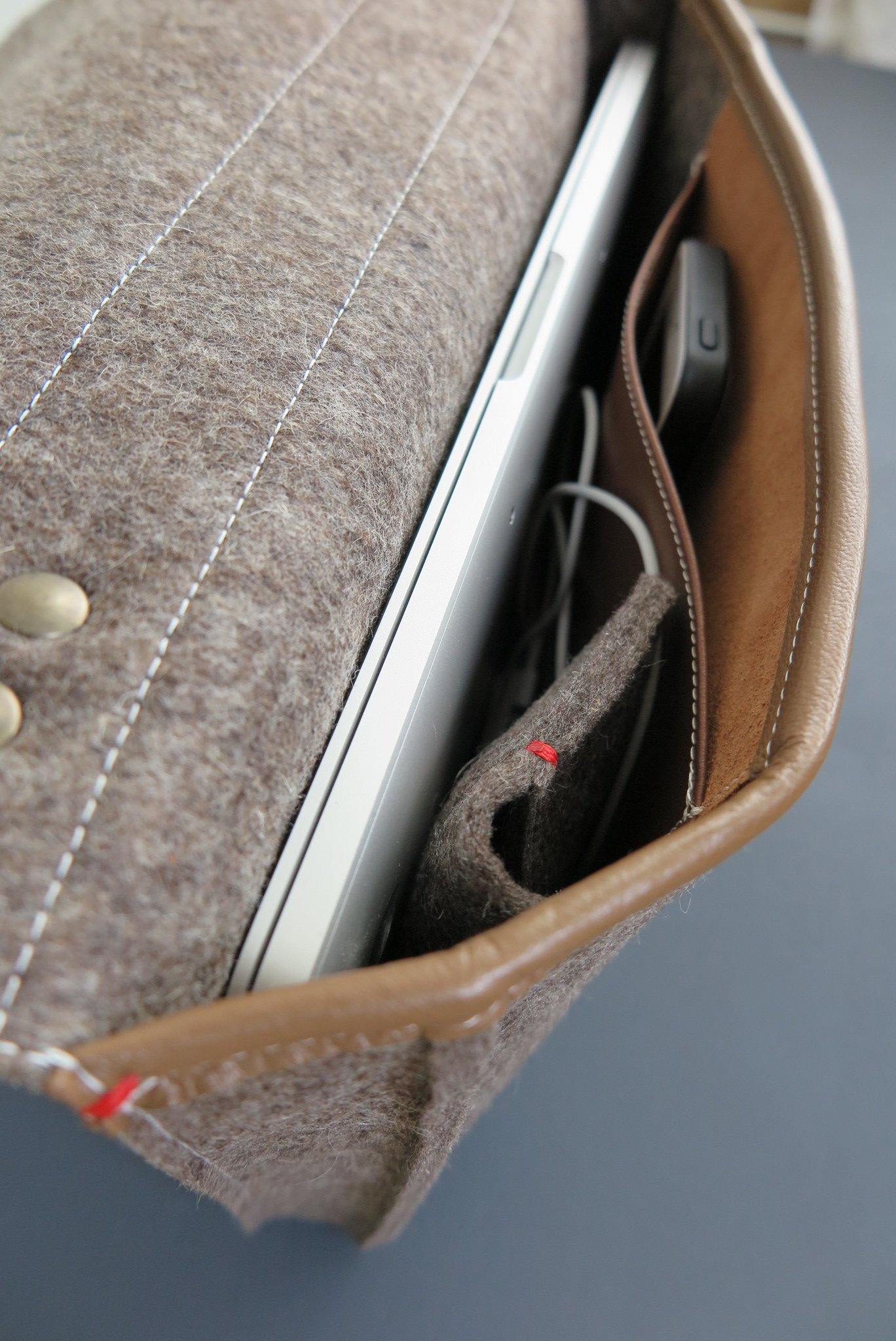 Interior leather pocket of felt briefcase