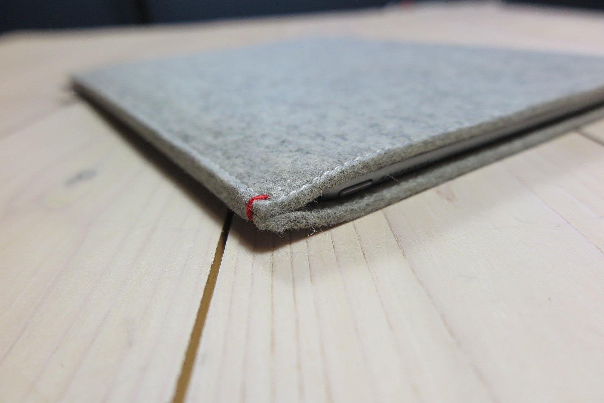 Grey wool felt iPad Pro case with a red detail