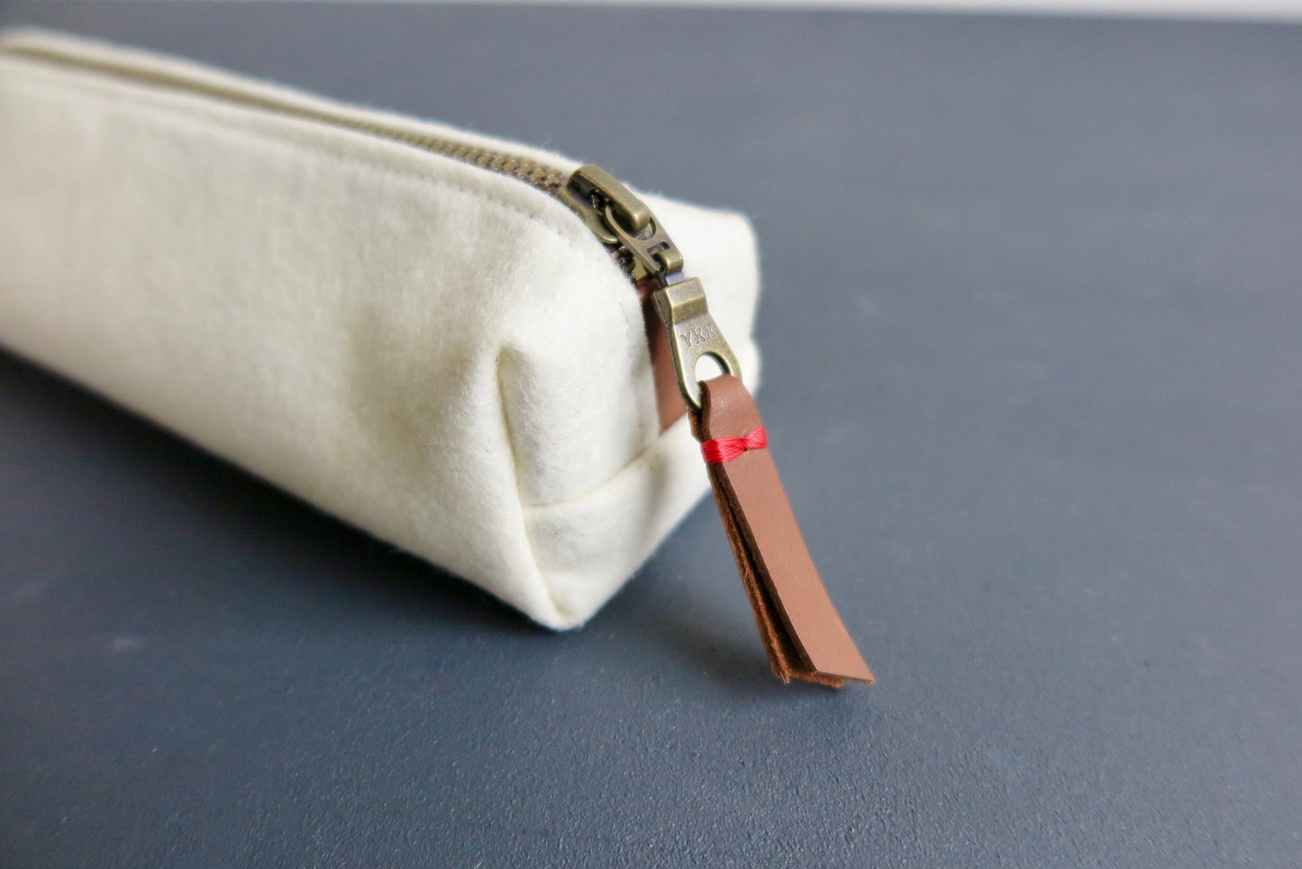 Leather pull tab on our YKK zipper pencil case