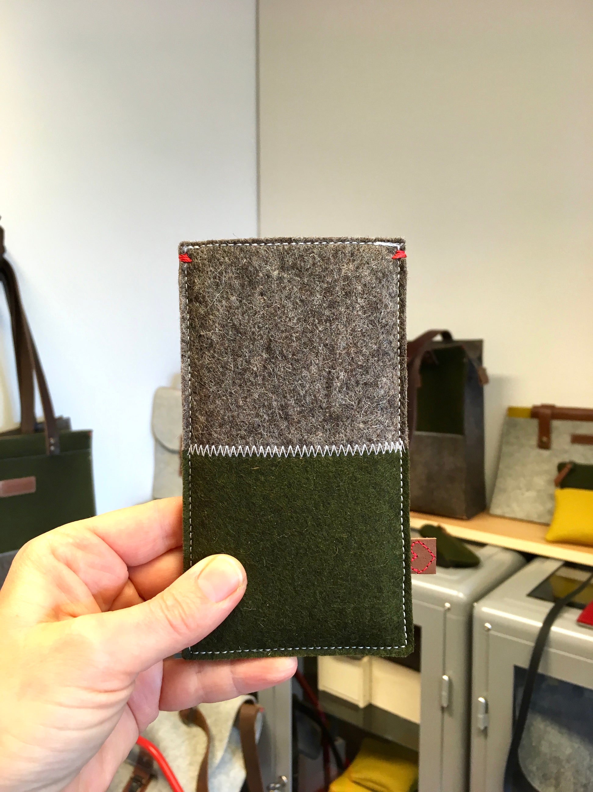 Fairphone felt case in natural green and grey