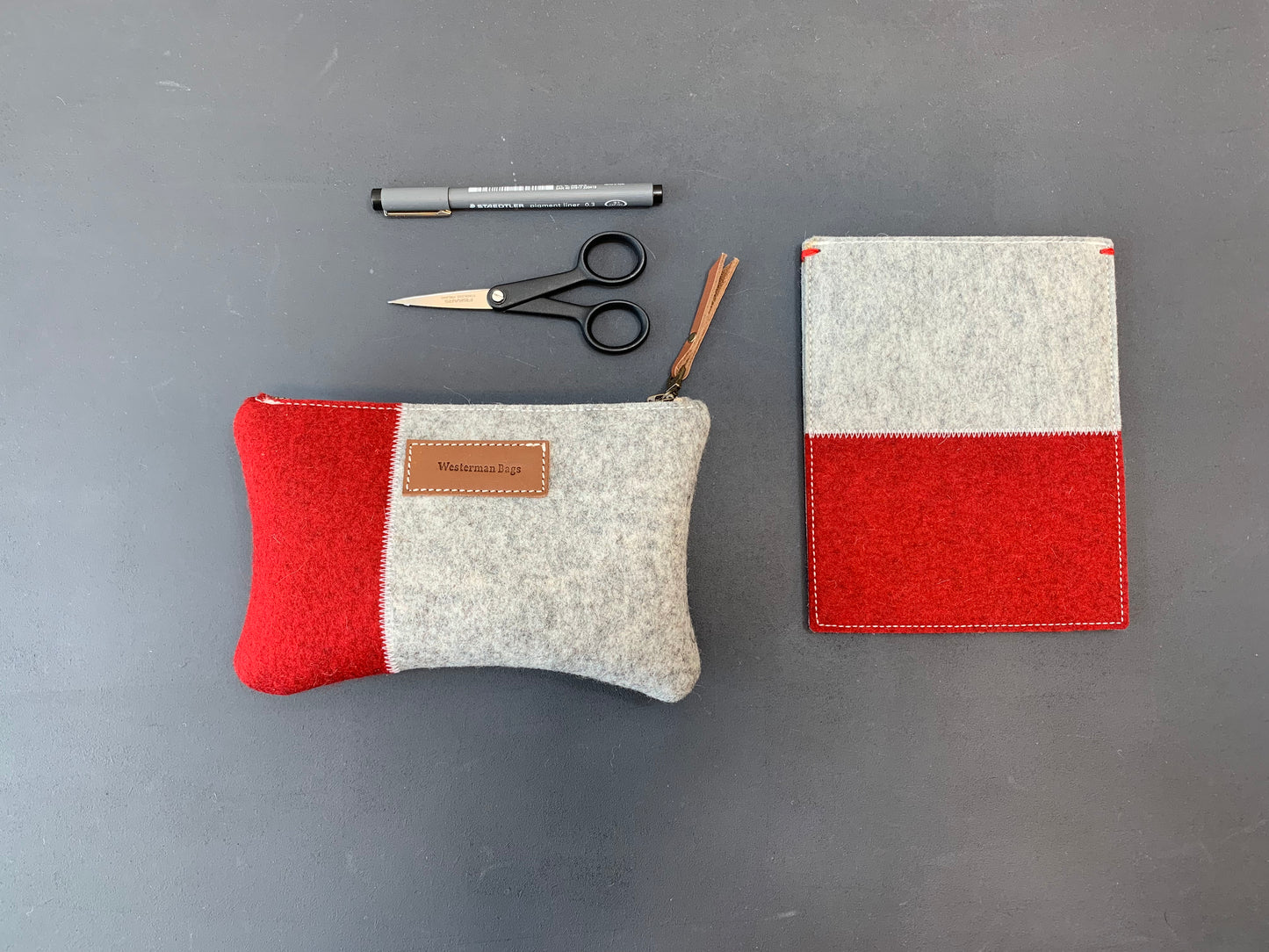 Red and grey. the signature of Westerman bags woolfelt design bags and cases