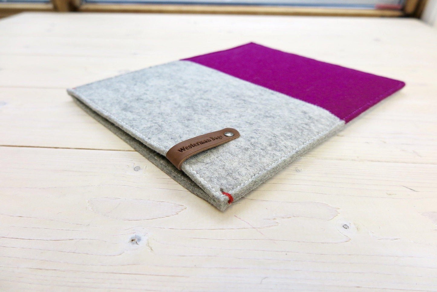 dark pink iPad sleeve made of pure wool felt