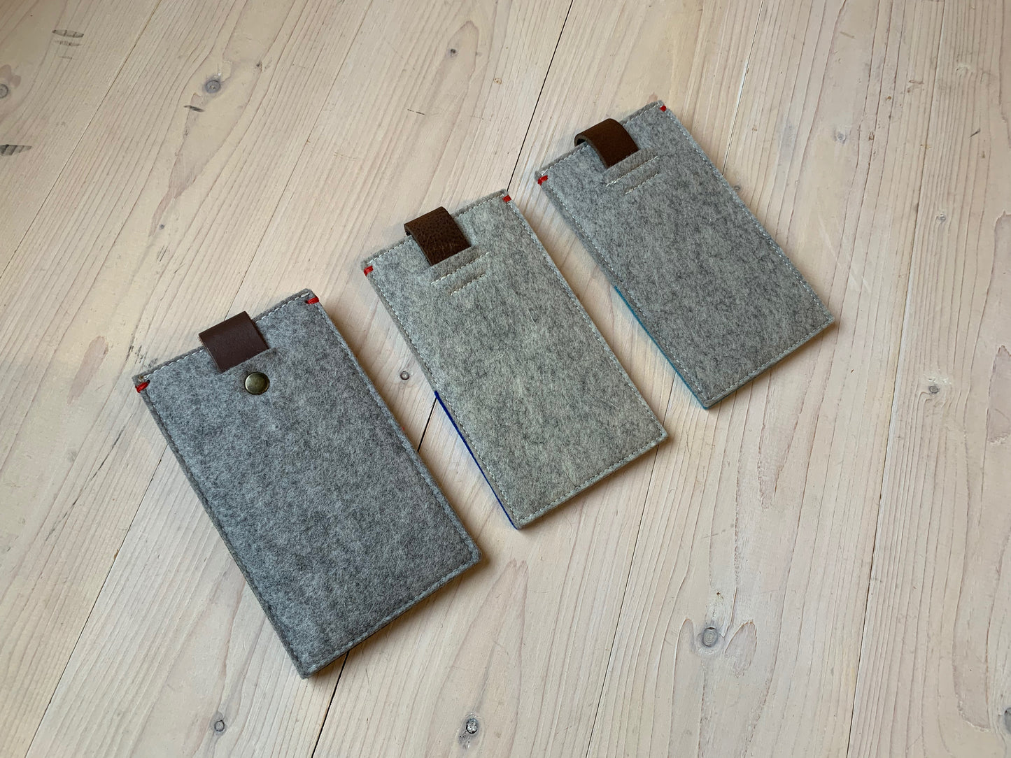 Sale of felt telephone covers with leather closure.